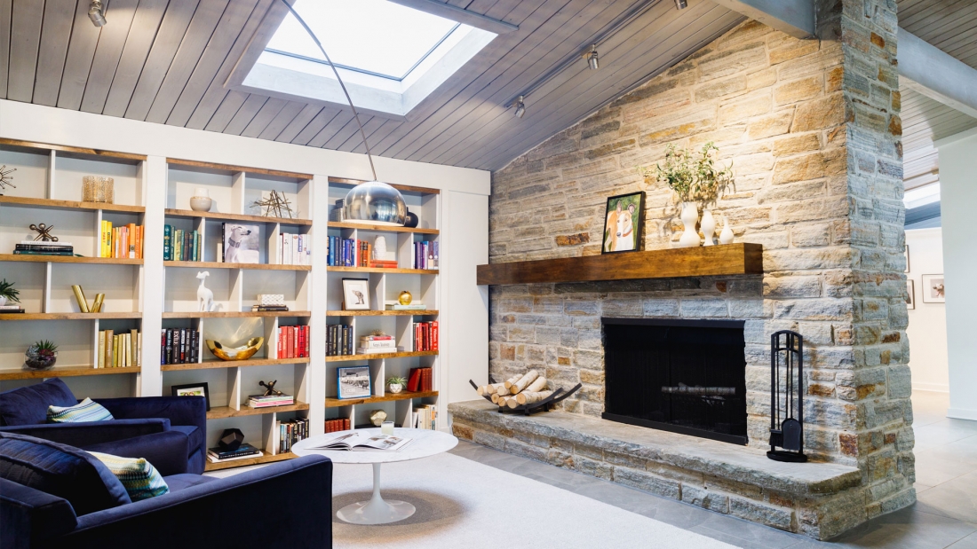 fireside-library-exposed-stone-live-edge-bookshelves-1100x619.jpg