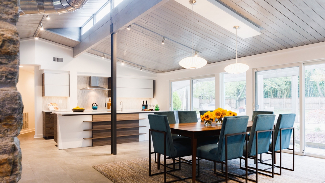 sleek-modern-kitchen-renovation-wood-tones-industrial-ceiling-1100x619.jpg