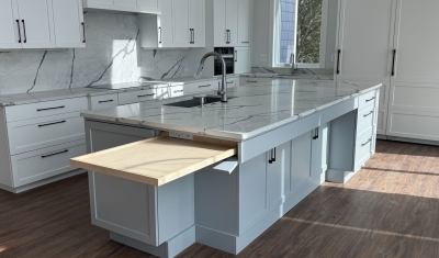 Pullout kitchen island shelf, hidden in island behind false drawer front